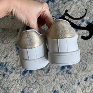 NWT, white sneakers with gold heel